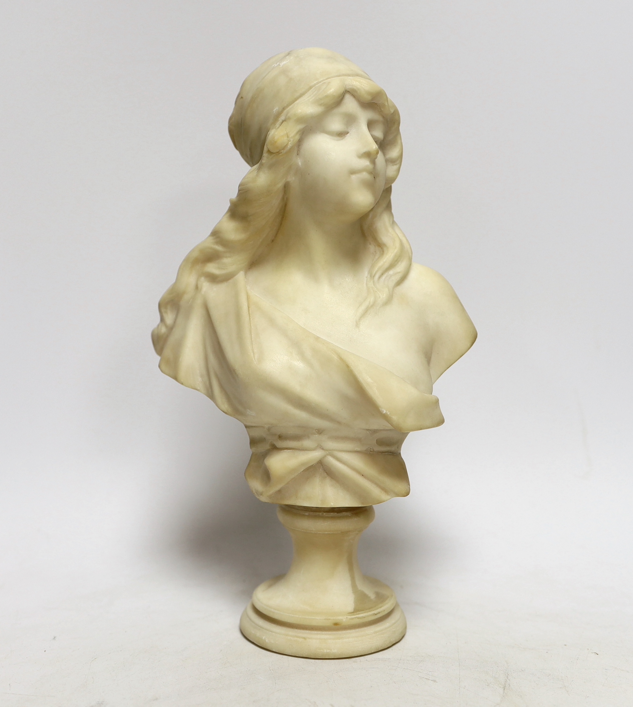 A small alabaster female bust signed H. Cipriani, 26.5cm high